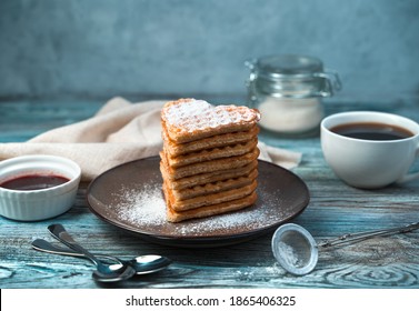 Sweet Dessert And Waffles With Powdered Sugar And Vanilla On A Wooden Gray-blue Background. Side View, Horizontal Orientation. Concept Of Culinary Backgrounds.