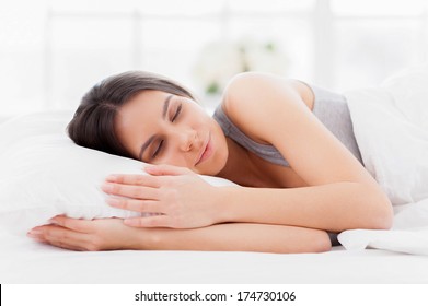 Sweet Dreams. Beautiful Young Woman Lying In Bed And Keeping Eyes Closed While Covered With Blanket