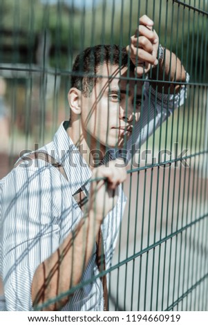 Similar – black haired man posing with sunglasses