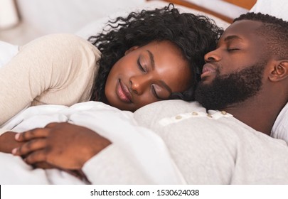 Sweet Dreams. Portrait Of Black Family Couple Sleeping Together In Bed, Closeup