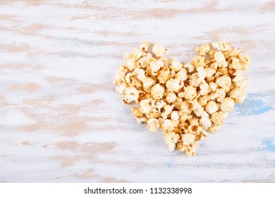 Sweet fried popcorn close up on color background. Food ingredients