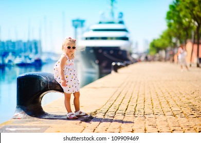 Sweet Girl In A Dock, Big Cruise Ship On Background