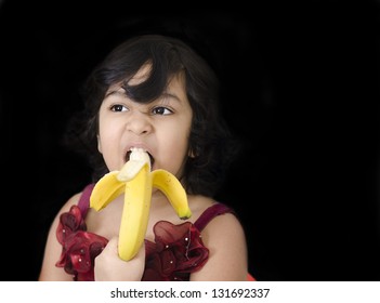 A Sweet Girl Eating Banana