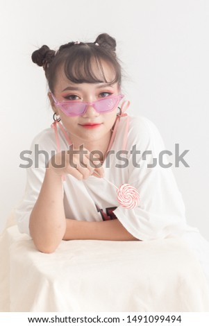Sweet girl with milk and lollipop 
