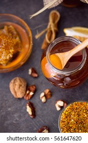 Sweet Healthy Honey In Glass Jar On The Black Table Top View
