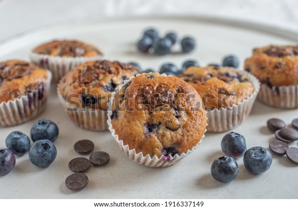 sweet\
home made chocolate blueberry muffins on a\
table