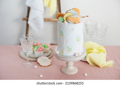 Sweet homemade cake with carrto cookies for Easter fiest, selective focus image