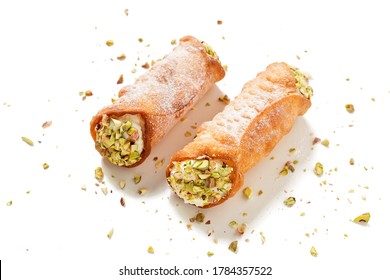 Sweet homemade cannoli stuffed with ricotta cheese  and pistachio. Sicilian dessert. Italian pastry. isolated on a white background