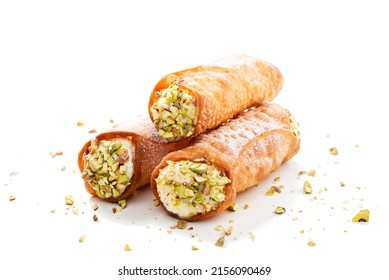 Sweet homemade cannoli stuffed with ricotta cheese and pistachio. Sicilian dessert. Italian pastry. isolated on a white background - Shutterstock ID 2156090469