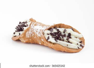 Sweet homemade sicilian cannolo stuffed with ricotta cheese cream and chocolate flakes