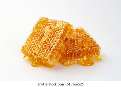 Sweet honeycomb isolated on white, bee products by organic natural ingredients concept