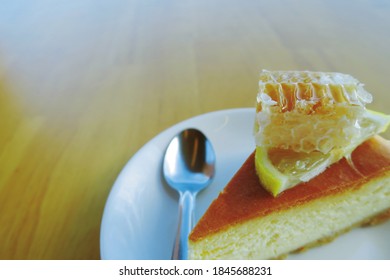 Sweet Honeycomb Placed On Lemon And Dessert Chees Cake