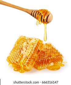 Sweet honeycomb and wooden dipper with dripping honey isolated on white background, bee products by organic natural ingredients concept