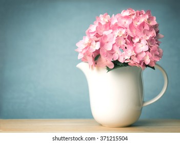 Sweet  Hydrangea Flowers In White Vase