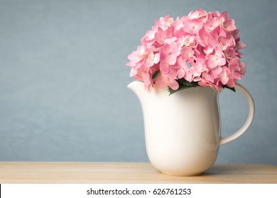 Sweet  Hydrangea Flowers In White Vase