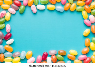 Sweet Jelly Beans On Blue Background.