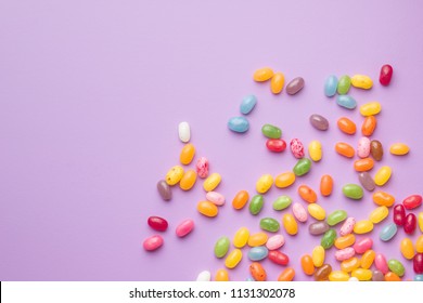 Sweet Jelly Beans On Colorful Background.