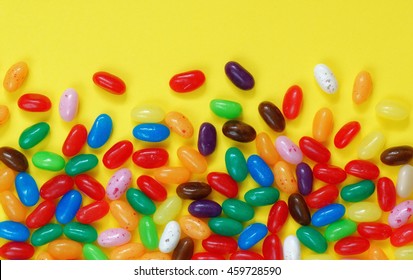 Sweet Jelly Beans On Yellow Background