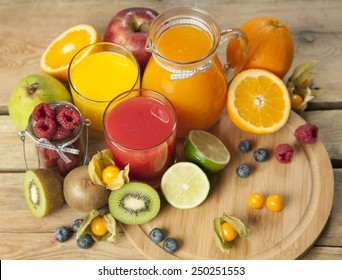 Sweet Juice And Fruits On Wood