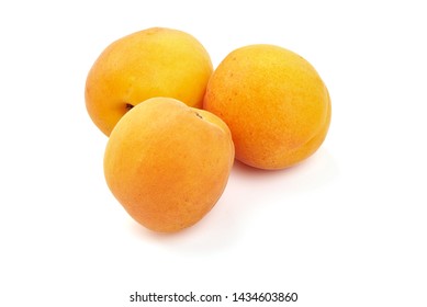 Sweet juicy apricots, ripe nectarines, close-up, isolated on white background. - Shutterstock ID 1434603860