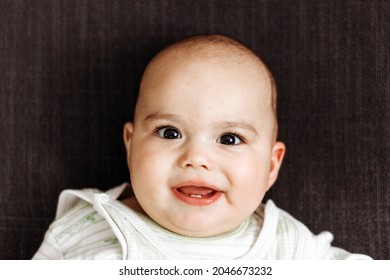 Sweet Little Baby Boy With Chubby Cheeks And Big Eyes. Portrait Of Happy Infant