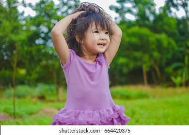 Sweet Little Girl In Purple Dress