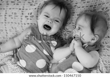 Similar – Little girl holding cookie sitting over the bed