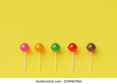 Sweet lollipop candy on pastel color background.