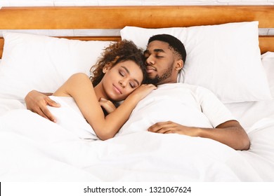 Sweet Love. Millennial Black Couple Embracing In Bed, Sleeping Together