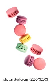Sweet macaroons falling on whitebackgrounds.French macarons cookie. Traditional dessert.