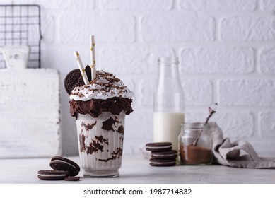 Sweet milkshake with chocolate cookies and whipped cream - Powered by Shutterstock