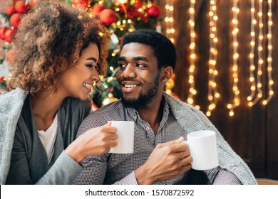 Sweet moment. African-american man and woman drinking coffee together, empty space