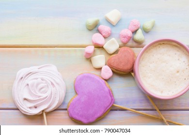 A Sweet Morning With A Cup Of Hot Coffee, Fresh Ginger Cookies And Marshmellow On Sticks And Gummy Fruit On A Colored Woden Table, Top View. Space For A Text Or Product Display