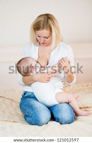 Similar – Image, Stock Photo young mother breast feeding her baby girl outdoors in a park