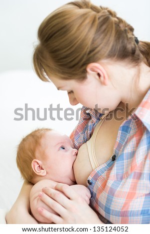 Similar – Image, Stock Photo young mother breast feeding her baby girl outdoors in a park