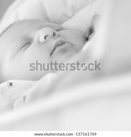 Similar – Newborn lying on bed embraced by her mother