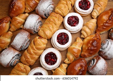 Sweet pastries, puff pastry, powdered sugar, nuts, jams, baked apples. - Shutterstock ID 636014792