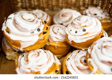 Sweet Pastry Cinnamon Raisin Bun With White Frosting