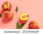 Sweet peaches and leaves on pink background