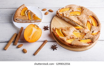 Sweet Persimmon Pie On White Wooden Background. Close Up.