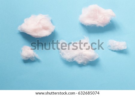 Sweet pink cotton candy on a blue background