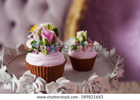  Sweet pink cupcakes decorated with flowers. Holiday cupcakes for wedding or birthday.   Copy space. Top of side view