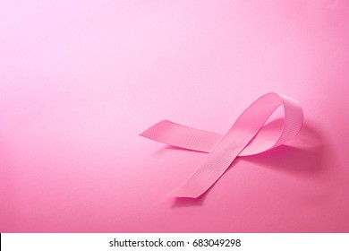 Sweet pink ribbon shape on pink background paper for Breast Cancer Awareness symbol to promote  in october month campaign