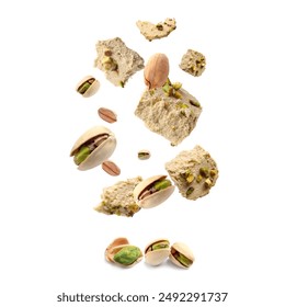 Sweet pistachio halva and nuts in air on white background