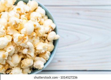 sweet popcorn on wood background