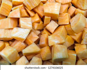 Sweet Potato Cubes On A White Background