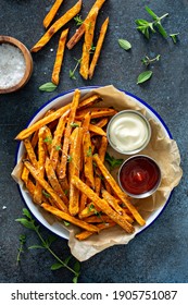 Sweet potato fries with mayo and ketchup, homemade roasted in the oven
