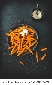 Sweet Potato Fries On A Metal Tray With Sour Cream Dip On Black Background, Top View