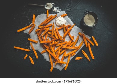 Sweet Potato Fries With Sour Cream Dip On Black Background, Top View