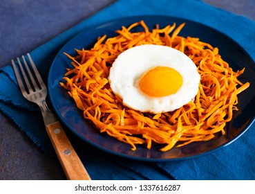 Sweet Potato Hash With Egg. Healthy Breakfast. Dark Blue Background. Top View